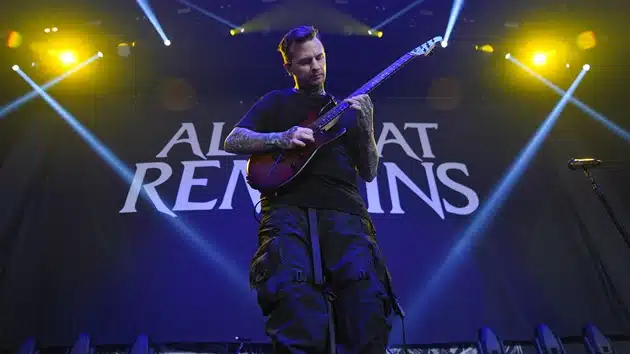 All That Remains Parts Ways with Guitarist Jason Richardson All That Remains guitarist Jason Richardson performing live on stage under dramatic lighting, 2025
