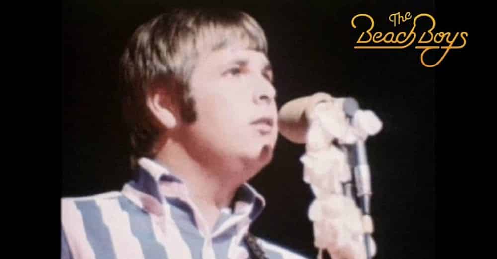 The Beach Boys performing live with singer at microphone wearing striped shirt - Brian Wilson Pet Sounds