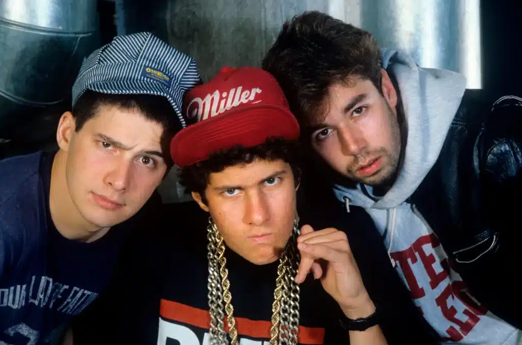 Beastie Boys in the 1980s – Mike D, MCA, and Ad-Rock posing in streetwear during their early hip-hop years