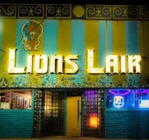 Lion’s Lair Denver dive bar and live music venue with neon sign on Colfax Avenue