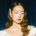 Laufey 2025 portrait photo with vintage styling and soft lighting