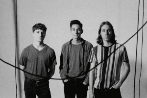 Black and white promotional portrait of the band Holdfast featuring Charlie, Tommy, and Mikey Maddocks for the Holdfast NYE 2025 show in Denver. (Why: It describes the visual content for accessibility while naturally working in the "Holdfast NYE 2025