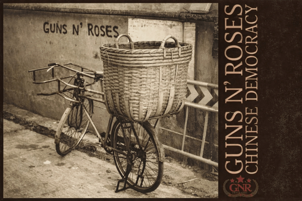 Guns N’ Roses Chinese Democracy: The 14-Year History Album cover art for Guns N' Roses Chinese Democracy featuring a sepia-toned bicycle with a wicker basket against a graffiti wall